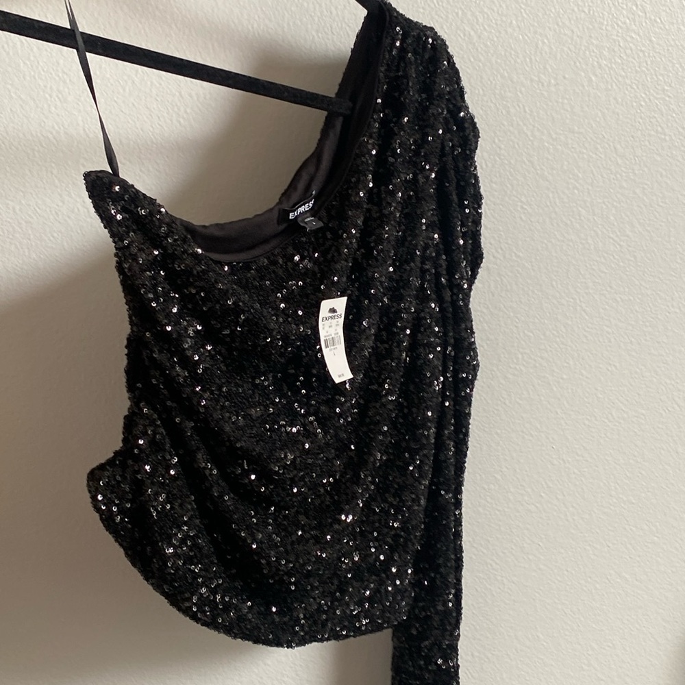 Sequin off  shoulder top. Selling because loose in bust area I wear a 36B bra.